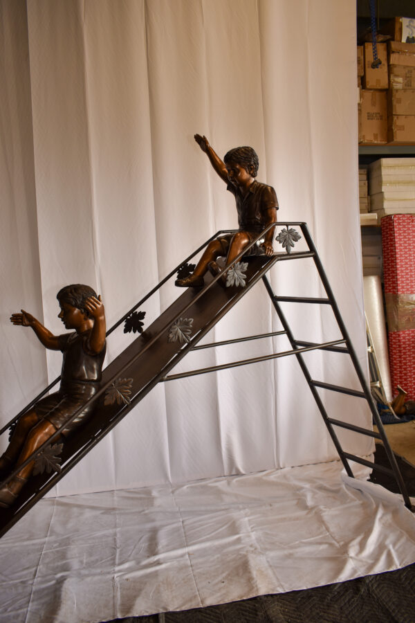 Lifsize Three kids playing on a slide bronze sculpture 114" x 18" x 83"H - Image 7
