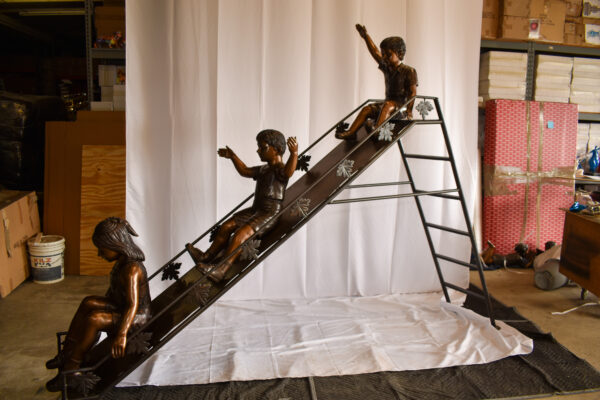 Lifsize Three kids playing on a slide bronze sculpture 114" x 18" x 83"H - Image 8