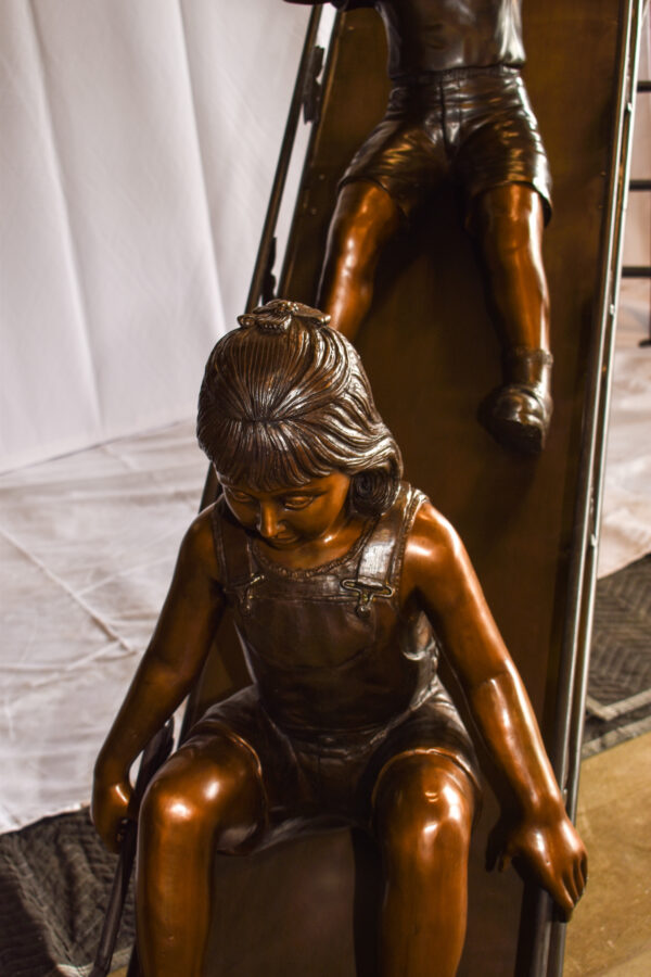 Lifsize Three kids playing on a slide bronze sculpture 114" x 18" x 83"H - Image 10