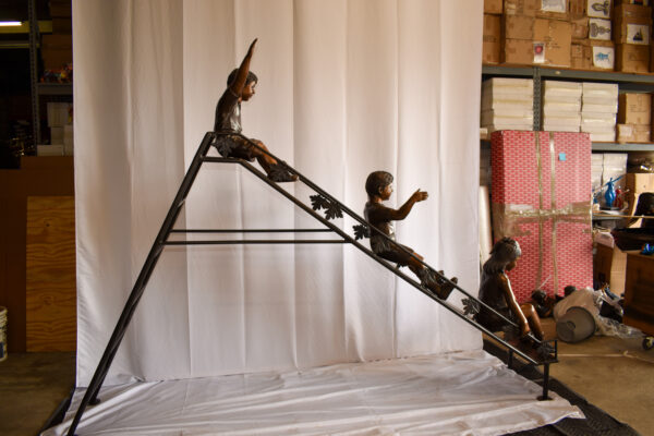 Lifsize Three kids playing on a slide bronze sculpture 114" x 18" x 83"H - Image 11