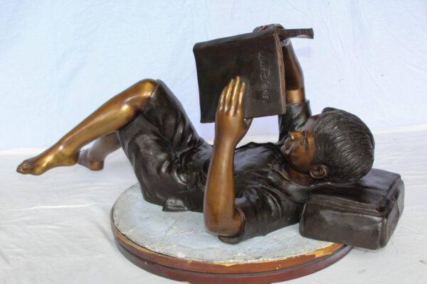 Boy Reading Bronze Statue with Book Raised Overhead 41" x 22" x 18"H - Image 4