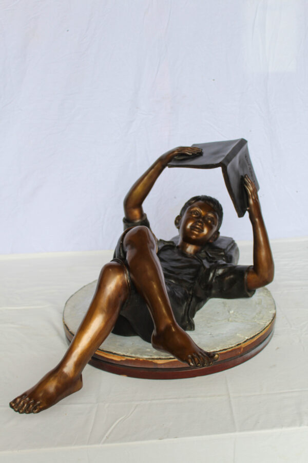 Boy Reading Bronze Statue with Book Raised Overhead 41" x 22" x 18"H - Image 9